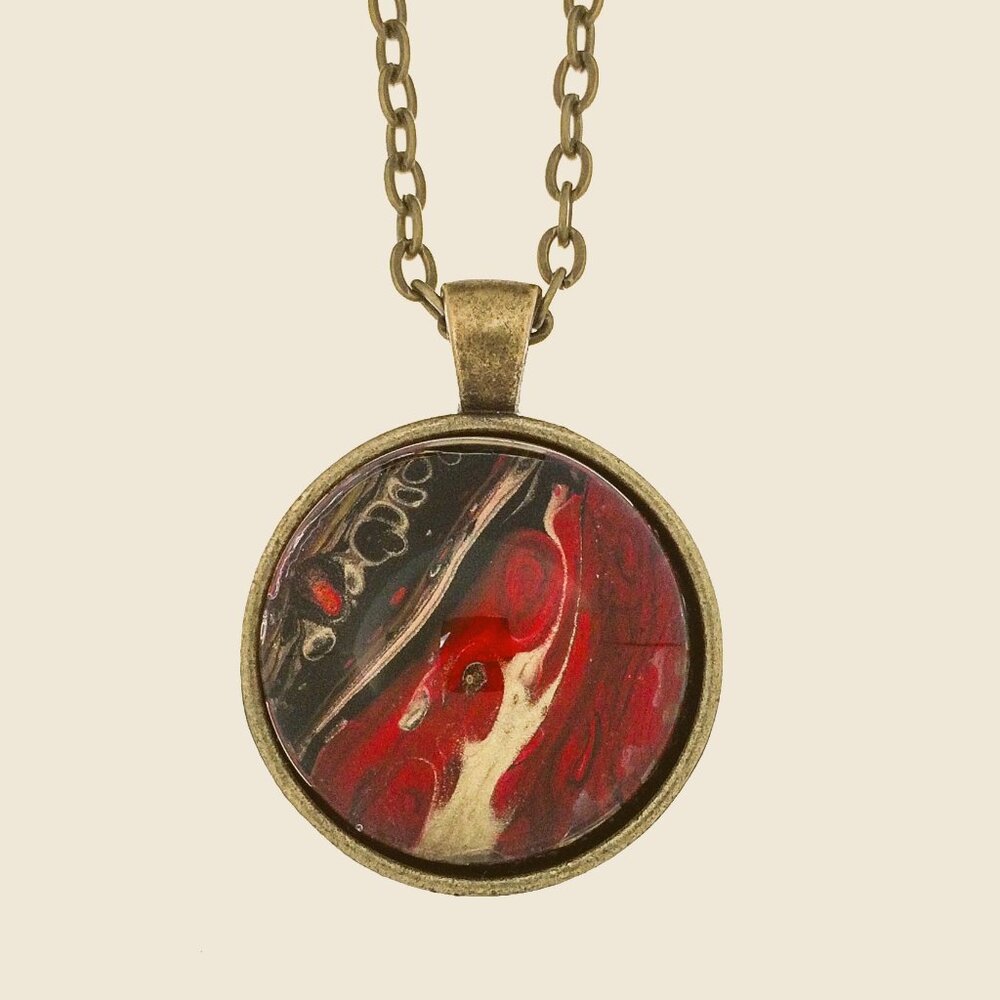 Handmade Abstract Pendant Necklace – Red, Black & Gold in a Round Brass Frame